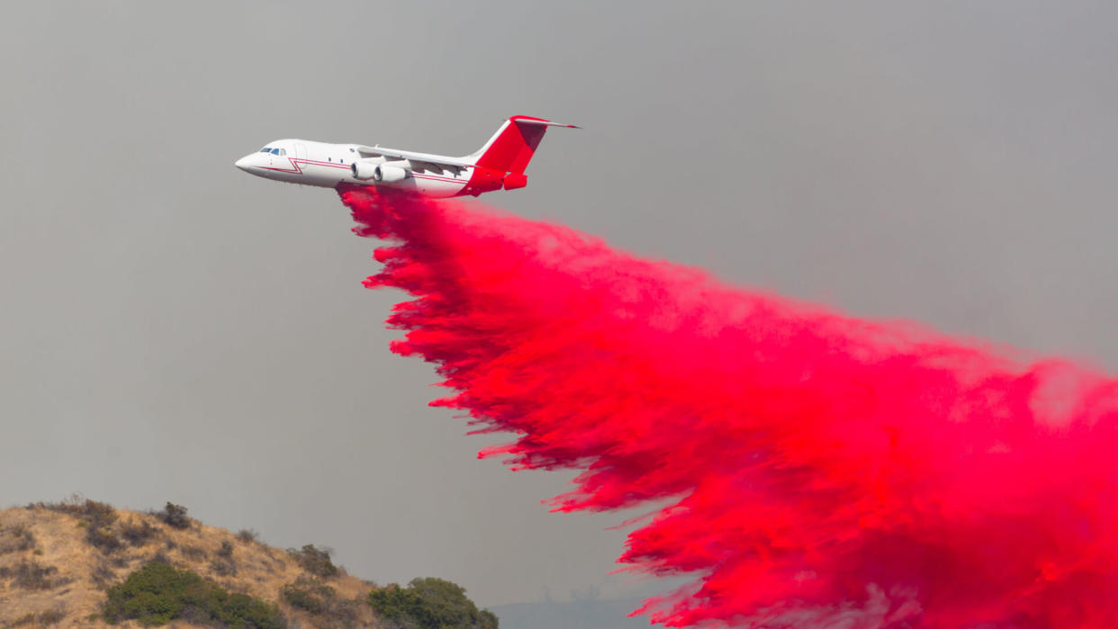 DC-10 flying around doing water and fire retardant drops on the moutains of Los Angeles.