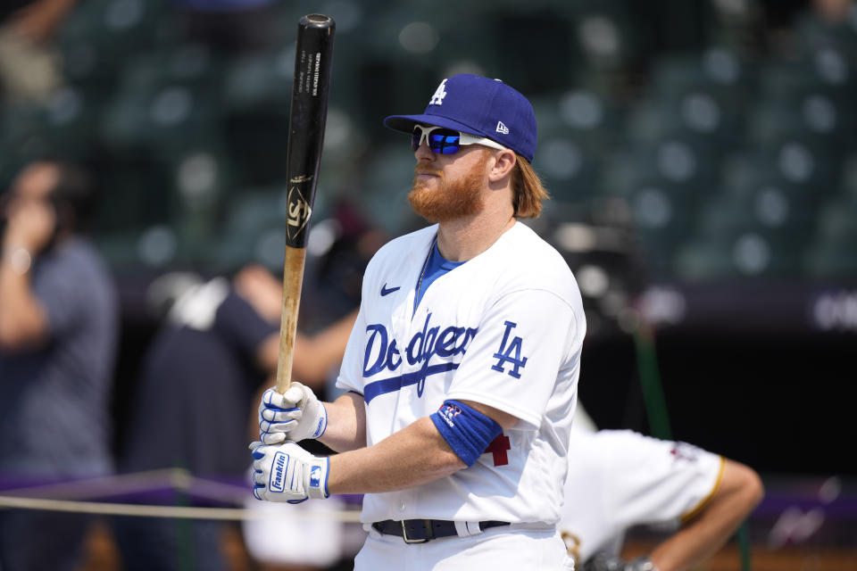 National League's Justin Turner, of the Dodgers warms-up during batting practice for the MLB All-Star baseball game, Monday, July 12, 2021, in Denver. (AP Photo/David Zalubowski)