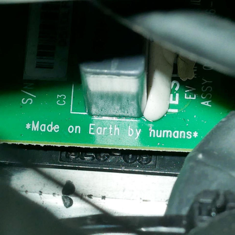 A circuit board inside Elon Musk’s Tesla Roadster, now in deep space, is imprinted "Made on Earth by humans." <cite>SpaceX</cite>