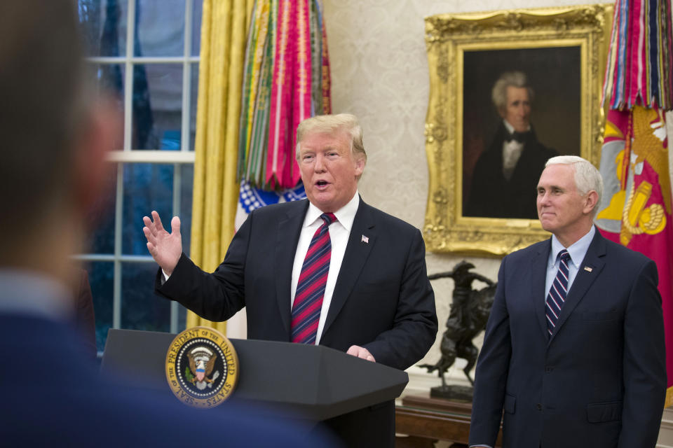 President Donald Trump speaks accompanied by Vice President Mike Pence, during a naturalization ceremony in the Oval Office of the White House, in Washington, Saturday, Jan. 19, 2019. (AP Photo/Alex Brandon)