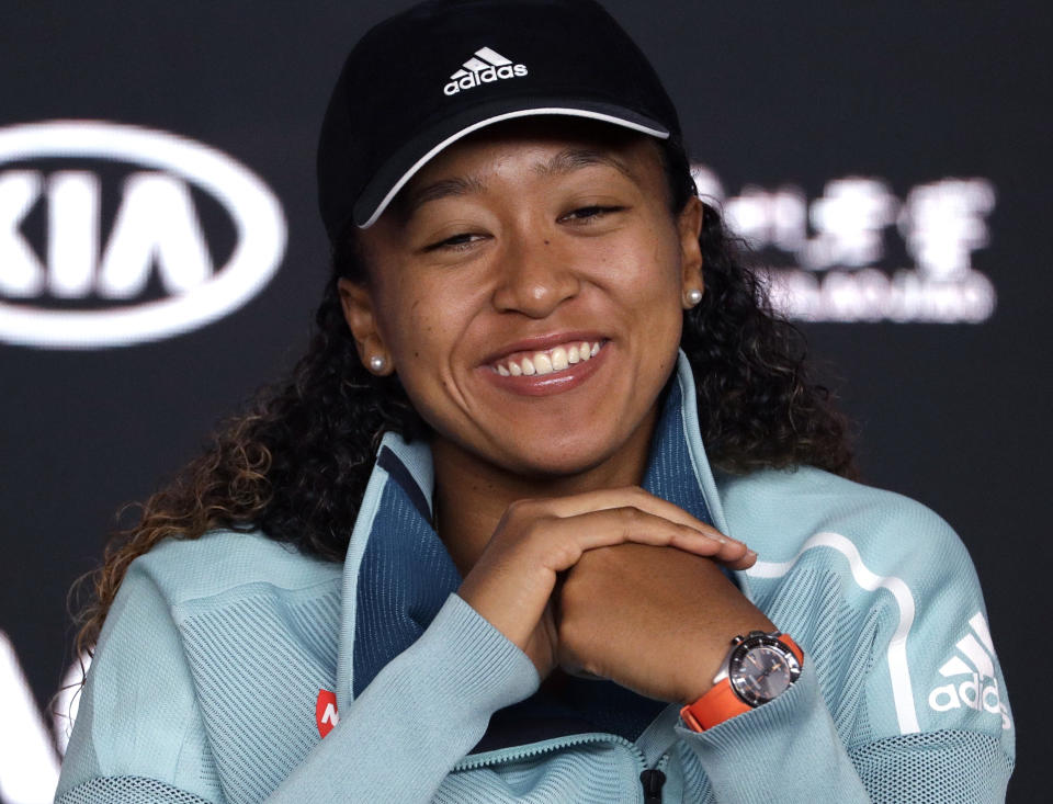 Japan's Naomi Osaka answers questions at a press conference following her win over Karolina Pliskova of the Czech Republic in their semifinal at the Australian Open tennis championships in Melbourne, Australia, Thursday, Jan. 24, 2019. (AP Photo/Mark Schiefelbein)