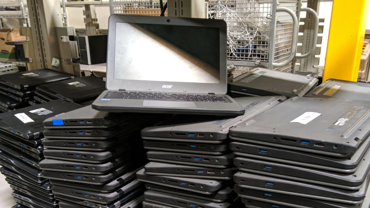  stacks of dead Chromebooks 