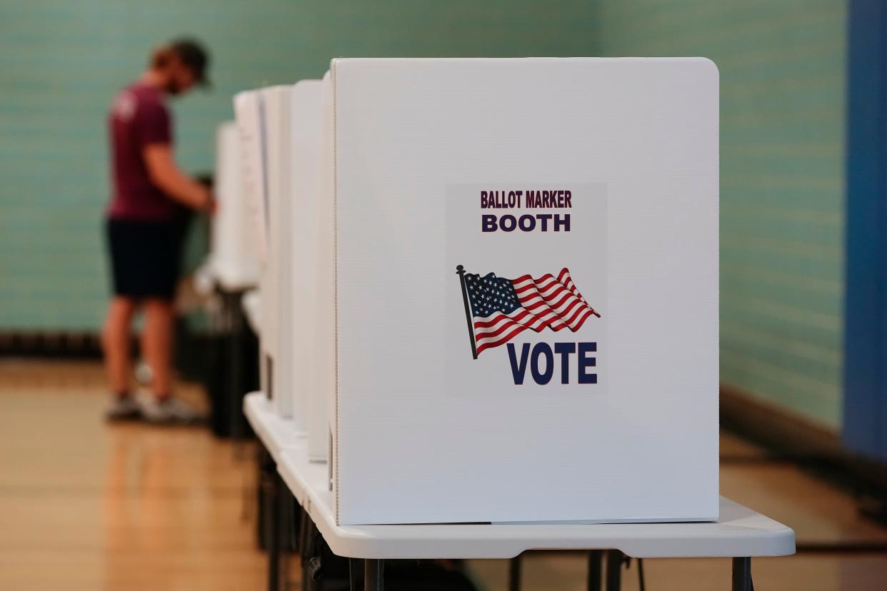 Voters cast their ballots during the Aug. 8 special election on Issue 1 at the Schiller Recreation Center in Columbus.