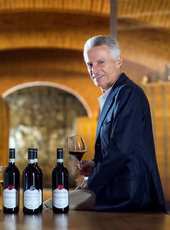 Italian businessman Riccardo Illy poses with a glass of wine in Montalcino, Italy September 29, 2016. Alexander Brookshaw/Handout via REUTERS