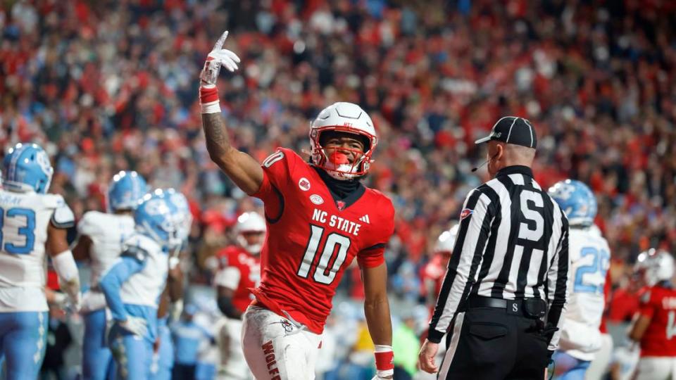 NC State’s KC Concepcion celebrates his first touchdown in the Wolfpack’s first half domination of UNC in Raleigh.