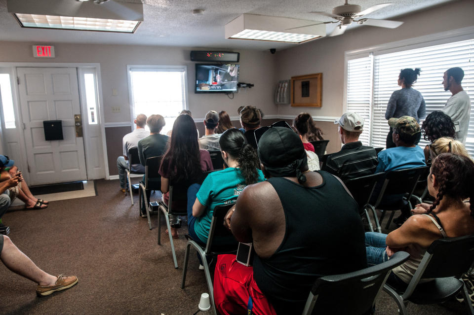 Patients watch watch TV while waiting for their number to be called to receive their medication at Carolina Treatment Center of Fayetteville.<i></i> (Photo: Joseph Rushmore for HuffPost)