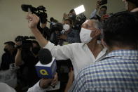 National Party presidential candidate Nasry Asfura show his ink stained finger after casting his ballot at a polling station during general elections in Tegucigalpa, Honduras, Sunday, Nov. 28, 2021. (AP Photo/Moises Castillo)