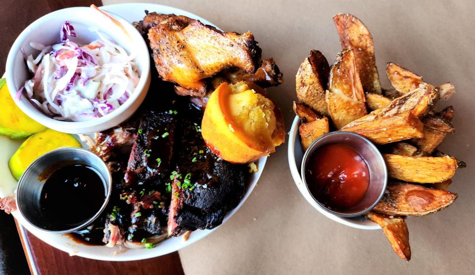 Great Northern BBQ offers a Sampler Plate for $28. It has wings, ribs and pulled pork with coleslaw, cornbread and pickles. Fries are a side dish.