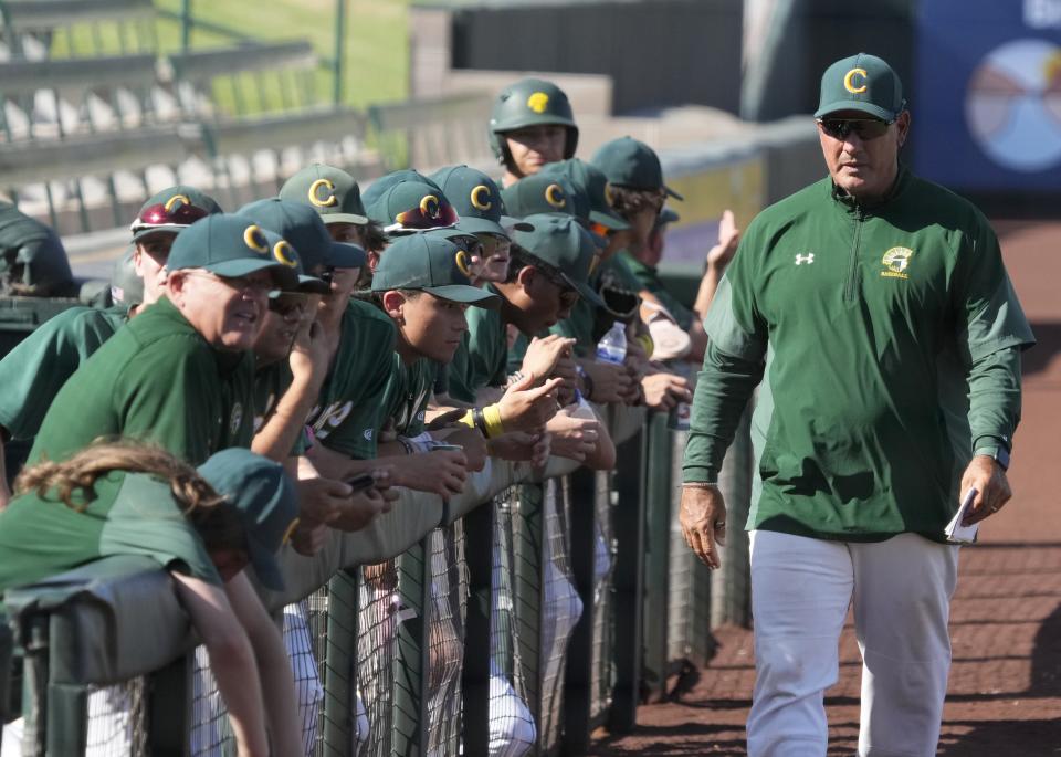 Canyon del Oro head coach Jason Hisey (right) prepares for a 4A baseball state tournament semifinal game against Estrella Foothills at Tempe Diablo Stadium on May 8, 2024.