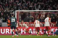 Bayern's Joshua Kimmich runs to celebrate after scoring his sides first goal during the Champions League quarter final second leg soccer match between Bayern Munich and Arsenal at the Allianz Arena in Munich, Germany, Wednesday, April 17, 2024. (AP Photo/Matthias Schrader)