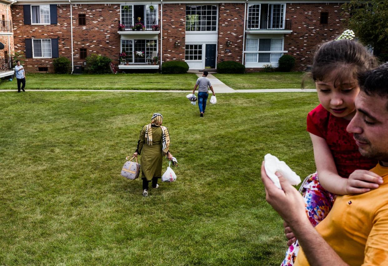 A family of Syrian refugees arrive at their new home in Bloomfield, Mich., in 2015. <a href="https://www.gettyimages.com/detail/news-photo/the-haji-khalif-family-arrives-at-their-new-home-on-july-24-news-photo/632671648?adppopup=true" rel="nofollow noopener" target="_blank" data-ylk="slk:Andrew Renneisen/Getty Images;elm:context_link;itc:0;sec:content-canvas" class="link ">Andrew Renneisen/Getty Images</a>