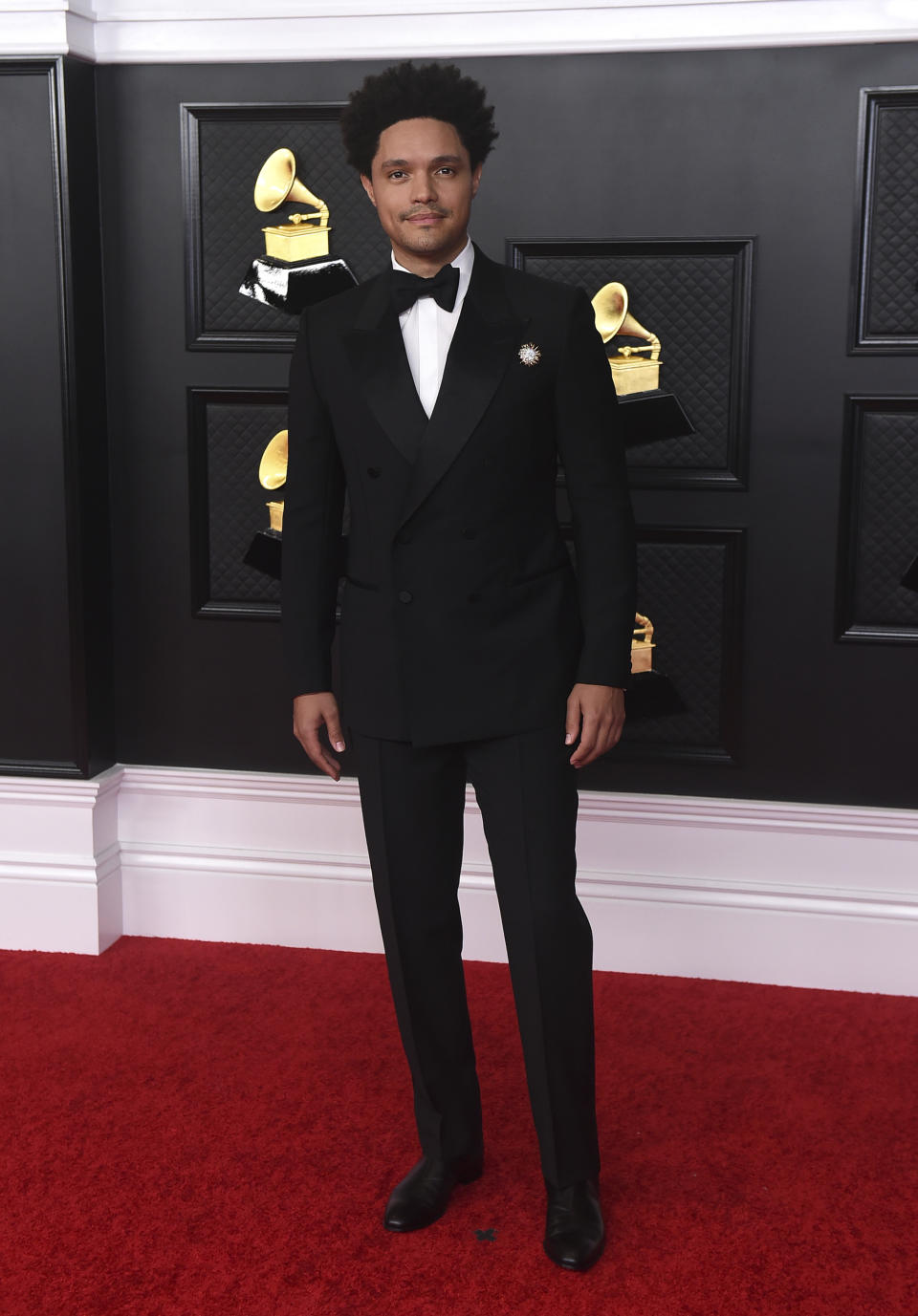 Trevor Noah arrives at the 63rd annual Grammy Awards at the Los Angeles Convention Center on Sunday, March 14, 2021. (Photo by Jordan Strauss/Invision/AP)