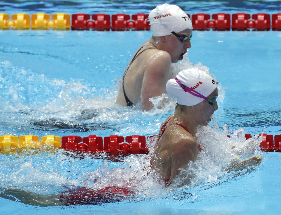 United States' Lilly King, top, and South Africa's Tatijana Schoenmaker swim inm their womens' 200m breaststroke heat at the World Swimming Championships in Gwangju, South Korea, Thursday, July 25, 2019. (AP Photo/Lee Jin-man )