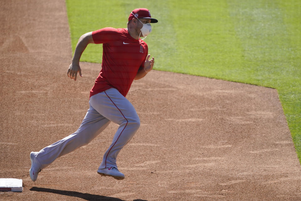 The Los Angeles Angels practice at Angels Stadium on Friday, July 3, 2020, in Anaheim, Calif. (AP Photo/Ashley Landis)