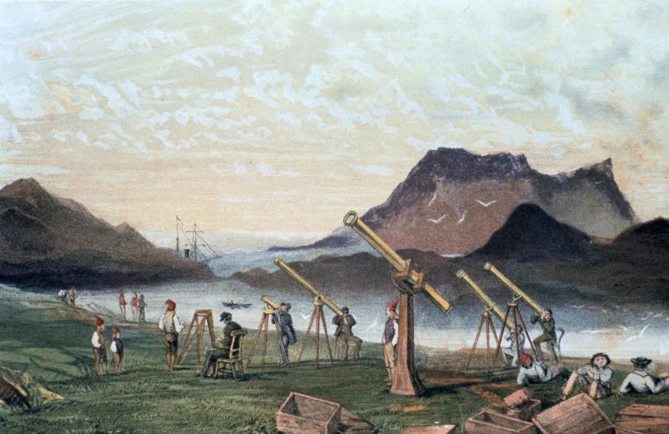 Total Solar Eclipse, 1851. Members of the Edinburgh expedition on Bue Island, Norway with their instruments set up ready for viewing the eclipse , 28 July 1851. Members of the crew from their transport vessel are seated on right by empty packing cases. From Astronomical Observations made at the Royal Observatory, Edinburgh.