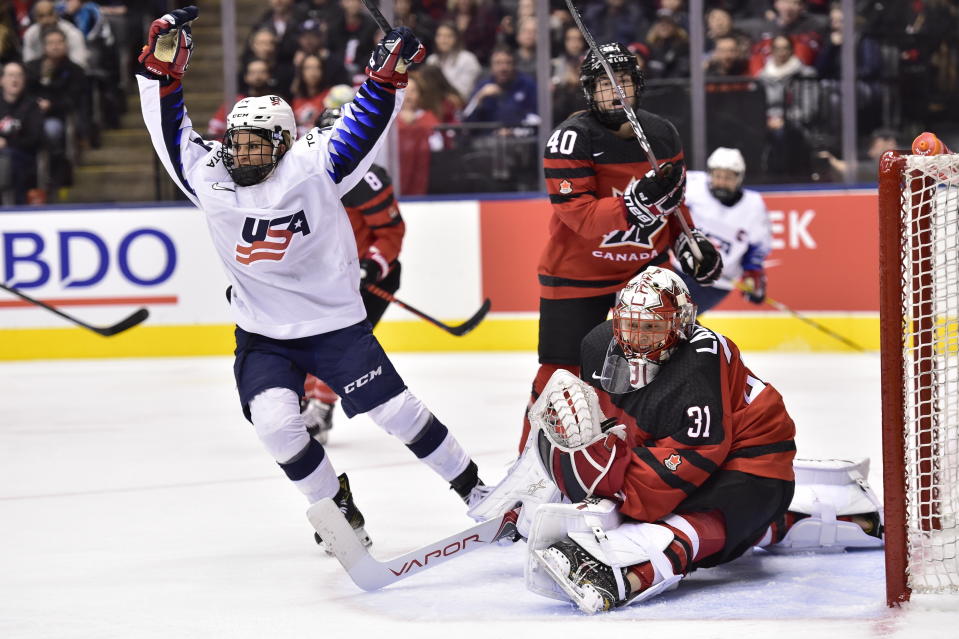 FILE - U.S. forward Brianna Decker (14) celebrates after she scored on Canada goalie Genevieve Lacasse (31) during the third period of a Rivalry Series hockey game Thursday, Feb. 14, 2019, in Toronto. Olympic gold medalist and six-time world champion Brianna Decker announced her retirement from the U.S. Women’s National Team, Thursday, March 2, 2023. (Frank Gunn/The Canadian Press via AP, File)