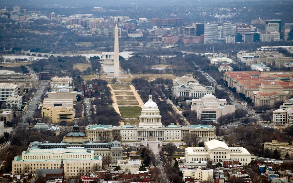 The skyline of Washington, D.C., including the U.S. Capitol building, Washington Monument, Lincoln Memorial. and National Mall, is seen from the air, Jan. 29, 2010.