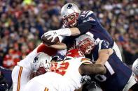 Jan 16, 2016; Foxborough, MA, USA; New England Patriots quarterback Tom Brady (12) dives for a touchdown during the second quarter against the Kansas City Chiefs in the AFC Divisional round playoff game at Gillette Stadium. Mandatory Credit: Greg M. Cooper-USA TODAY Sports