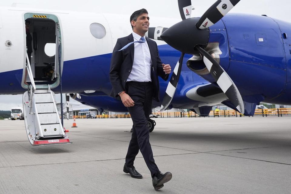 Rishi Sunak arrives for a campaign event at Inverness airport (Stefan Rousseau/PA Wire)