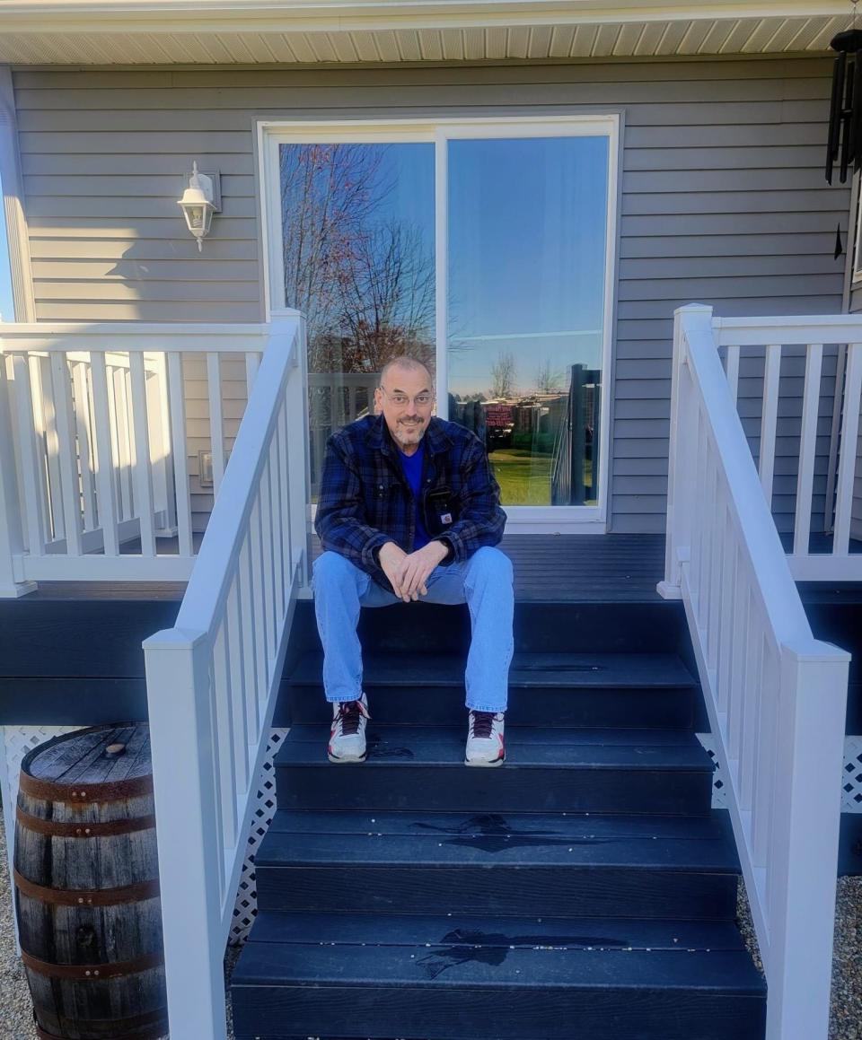 Tim Cornett poses for a photo back home in Plymouth after receiving two new lungs in Miami as a result of the damage COVID-19 did to his lungs.