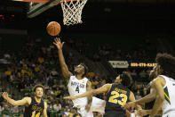 Baylor guard LJ Cryer (4) shoots a layup over Arkansas-Pine Bluff forward Trey Sampson (23) in the first half of an NCAA college basketball game in Waco, Texas, Saturday, Dec. 4, 2021. (AP Photo/Emil Lippe)