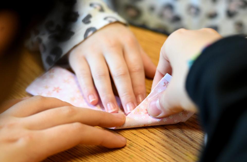 A group of Japanese students hosted by University of Mount Union and staying with host families visited Union Avenue United Methodist Church's preschool class to meet the students and teach origami on Wednesday,  March 29, 2023.