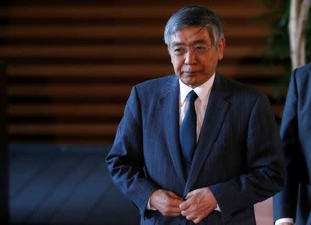 Bank of Japan (BOJ) Governor Haruhiko Kuroda walks after meeting with Japan's Prime Minister Shinzo Abe at Abe's official residence in Tokyo, Japan January 11, 2017. REUTERS/Toru Hanai