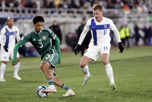 Jamal Lewis of Northern Ireland, left, is challenged by Rasmus Schuller (Roni Rekomaa/AP)