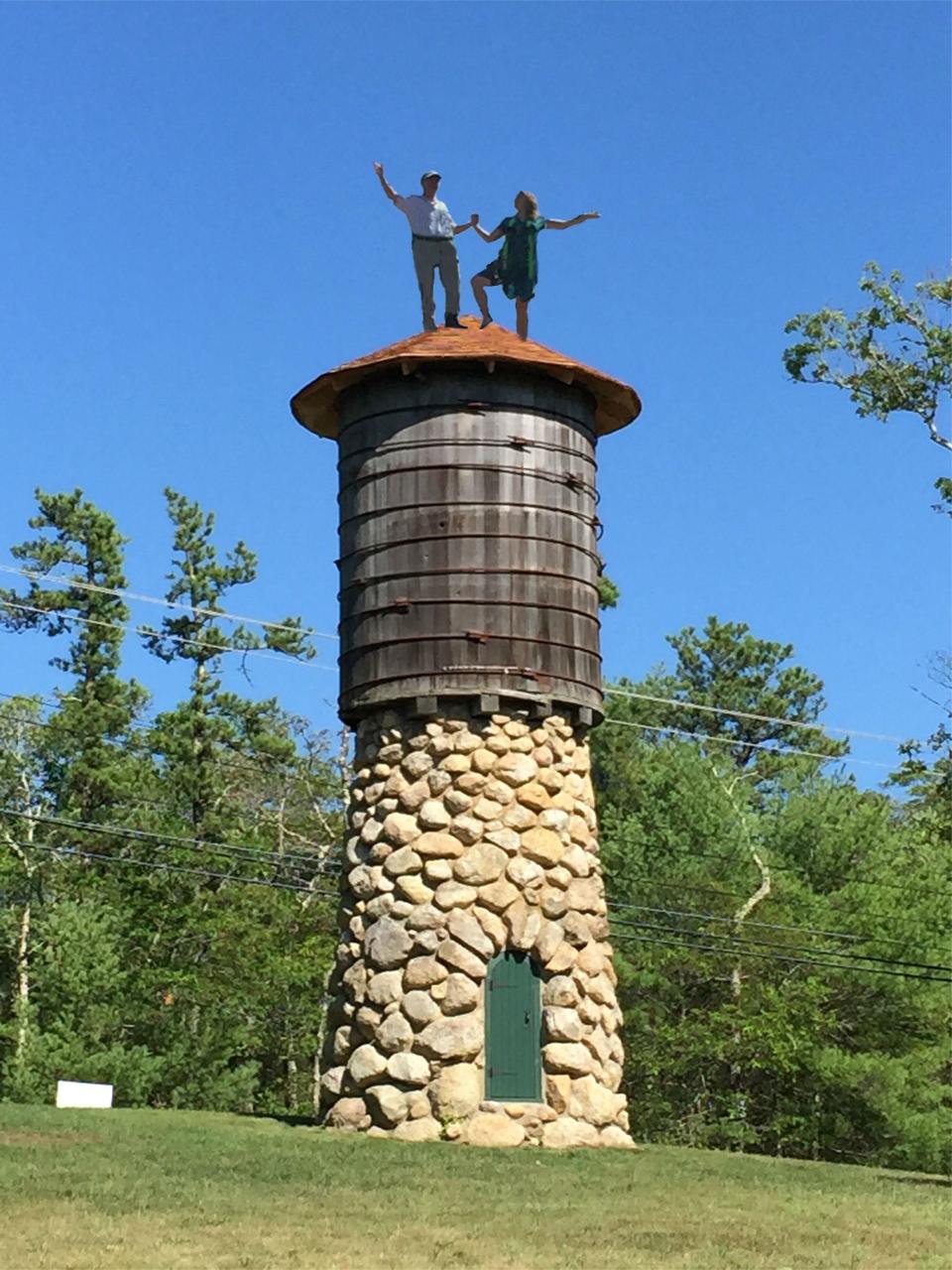 In 2015, Sam Chapin, great-grandson of Howland and Anna Davis, and Hester Earle, great-great-granddaughter of Howland and Anna Davis, re-create a family photo by standing on top of the water tower at the Davis-Douglas Farm in Plymouth. Hester is the great-granddaughter of the woman in the original water tower photo. The safety equipment that supported their climb to the top was photo shopped out of this photo.