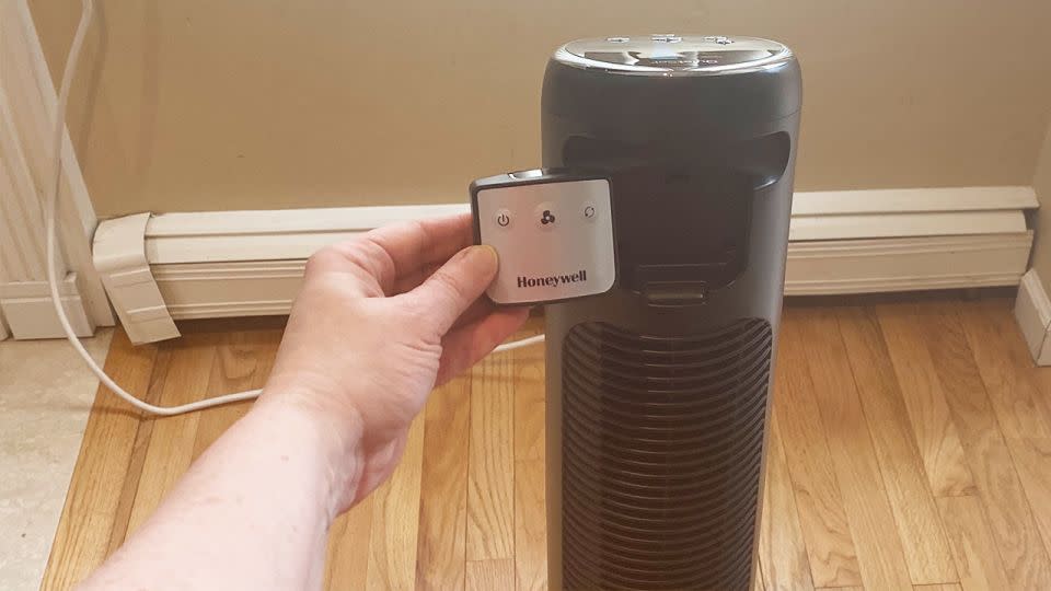 The remote control easily slides and stays in place in the storage area of the Honeywell Quietset tower fan. - Suzanne Kattau/CNN Underscored