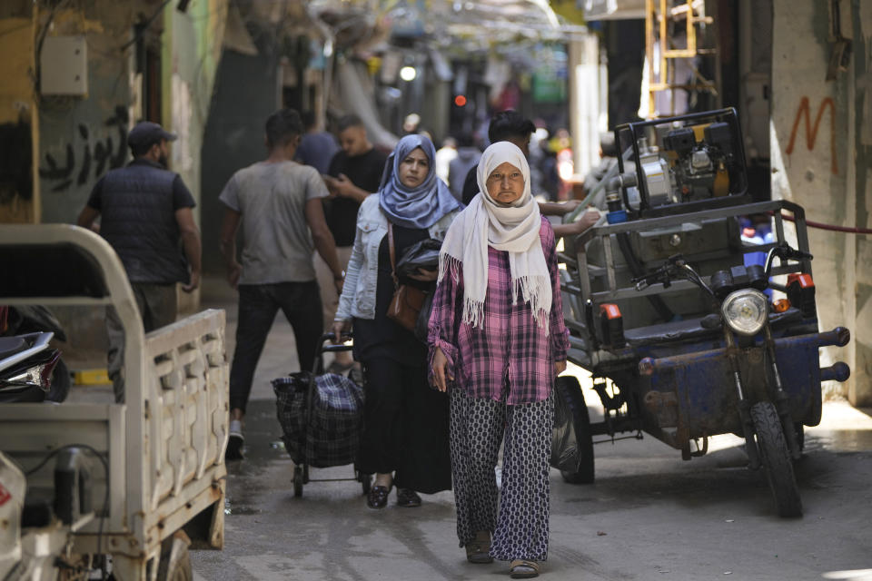 Palestinian walks at the Palestinian refugee camp of Shatila in Beirut, Lebanon, Wednesday, May 15, 2024. The Nakba, Arabic for "catastrophe," refers to the 700,000 Palestinians who fled or were driven out of what today is Israel before and during the war surrounding its creation in 1948. (AP Photo/Hassan Ammar)