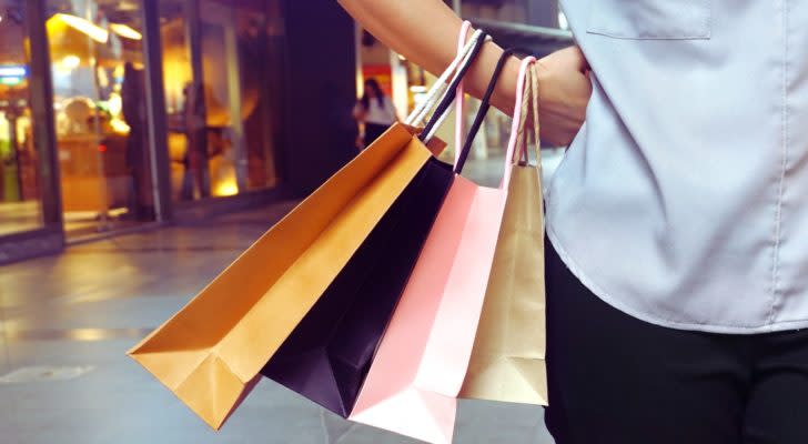 a person carrying several shopping bags