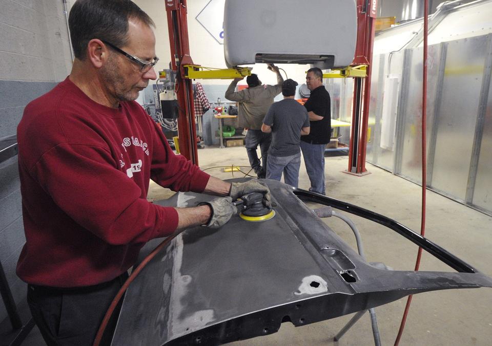 A student enrolled in an auto body program sands a door inside the Erie Institute of Technology auto body training facility. Auto body repair workers in 2022 earned an average of $49,970 in Pennsylvania, according to the Department of Labor & Industry.