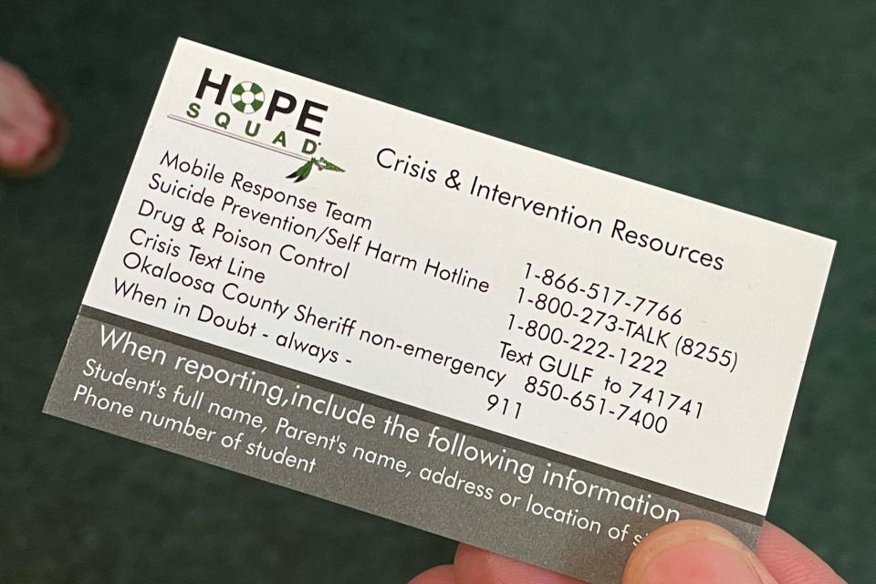 A business card for the Choctawhatchee High School Hope Squad program features resources for students to turn to in times of crisis. Hope Squad is a peer-to-peer suicide prevention program.