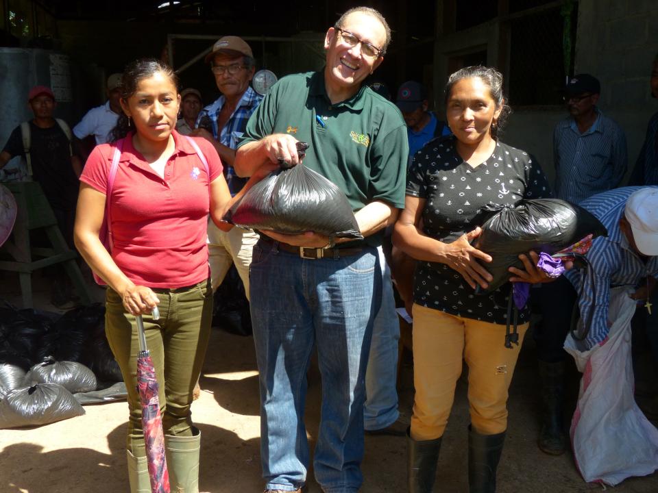 Self-Help Nicaragua Country Director Jorge Campos distributed 15-pound sacks of bio-fortified beans in November 2019 to two farmers who are members of the Los Chiles Cooperative.