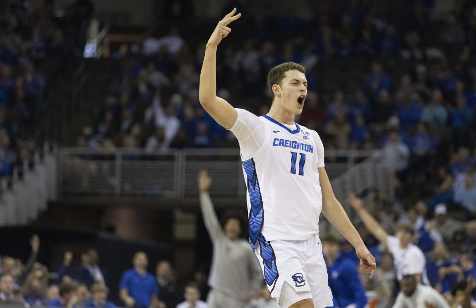 Creighton's Ryan Kalkbrenner (11) reacts after hitting a 3-point basket against Holy Cross during the first half of an NCAA college basketball game on Monday, Nov. 14, 2022, in Omaha, Neb. (AP Photo/Rebecca S. Gratz)
