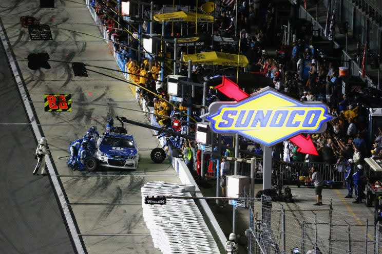 Dale Earnhardt Jr.’s crew works on his car on pit road. (Getty)