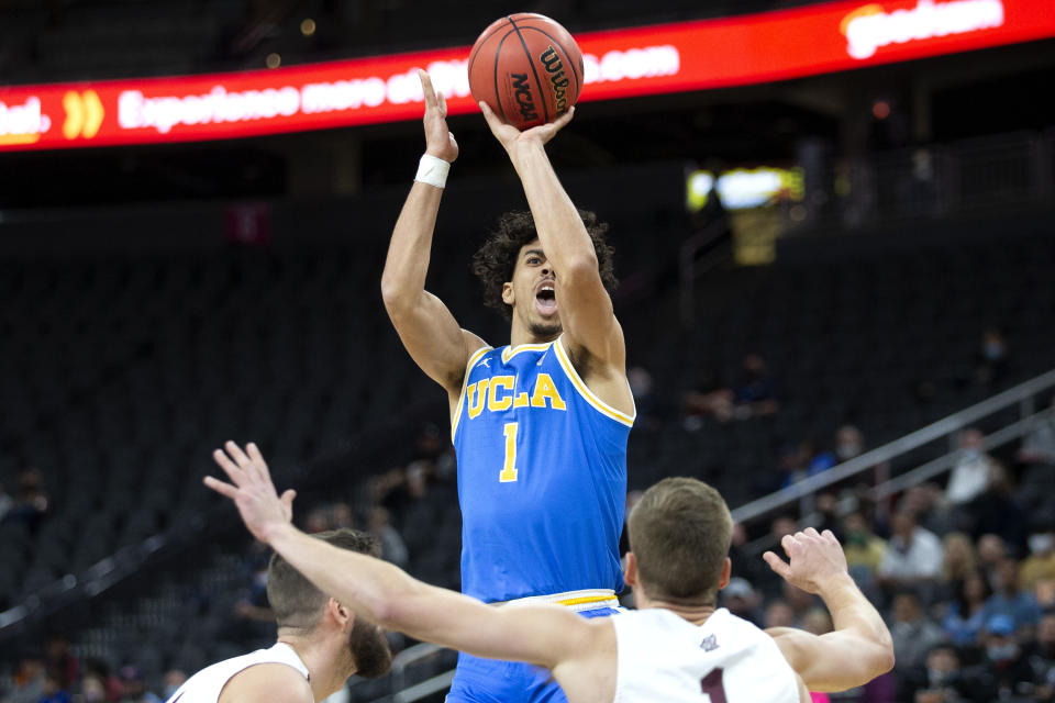 UCLA guard Jules Bernard (1) shoots as Bellarmine forward Ethan Claycomb, left, and guard Juston Betz defend during the first half of an NCAA college basketball game Monday, Nov. 22, 2021, in Las Vegas. (AP Photo/Ellen Schmidt)