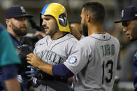 Seattle Mariners' Luis Torrens is congratulated by Abraham Toro (13) after Torrens' home run during the eighth inning of the team's baseball game against the Oakland Athletics in Oakland, Calif., Wednesday, Sept. 21, 2022. (AP Photo/Jeff Chiu)