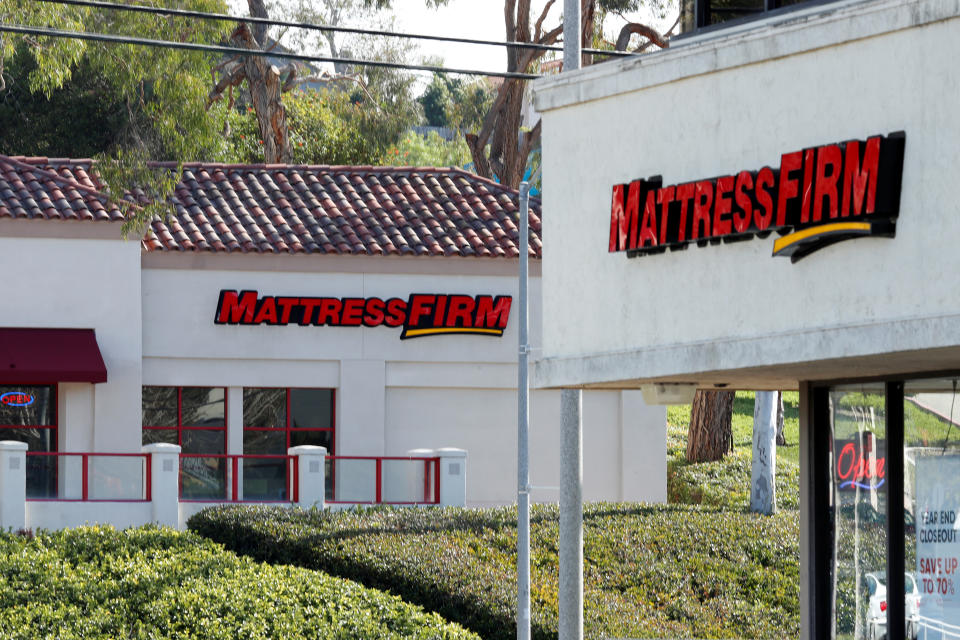 Two Mattress Firm stores, a brand owned by Steinhoff, lie on either side of the street in Encinitas, California, U.S., January 25, 2018.    REUTERS/Mike Blake