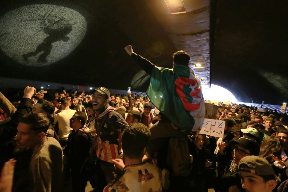Hundreds of students gather under a tunnel in central Algiers to protest Algerian President Abdelaziz Bouteflika's decision to seek fifth term, Tuesday, March 6, 2019. Algerian students are gathering for new protests and are calling for a general strike if he doesn't meet their demands this week. (AP Photo/Toufik Doudou)