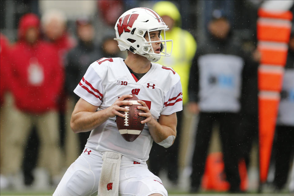 Wisconsin quarterback Jack Coan drops back to pass against Ohio State during the first half of an NCAA college football game Saturday, Oct. 26, 2019, in Columbus, Ohio. (AP Photo/Jay LaPrete)