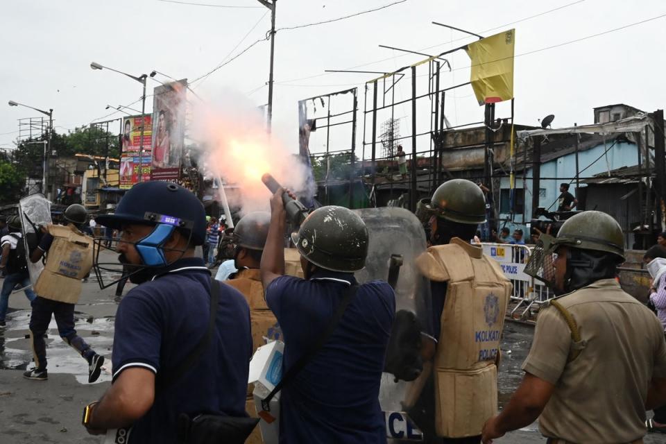 Police fire tear gas to disperse Bharatiya Janata Party members (AFP via Getty Images)