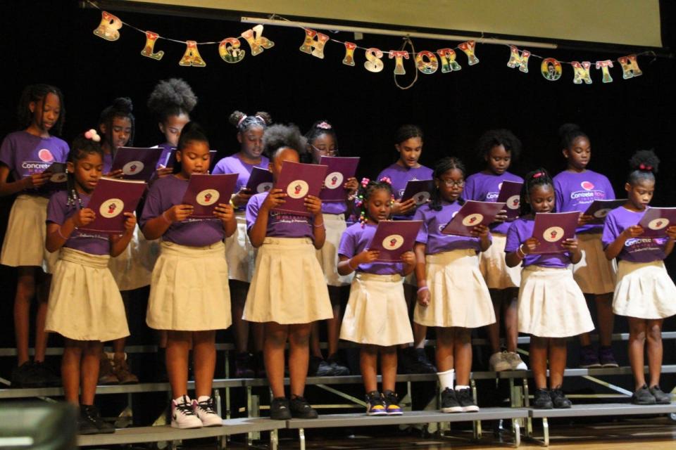 Girls from the Concrete Roses mentoring program sing the Negro National Anthem during a Black History Month program at Stephen Foster Elementary School.
(Photo: Photo by Voleer Thomas/For The Guardian)