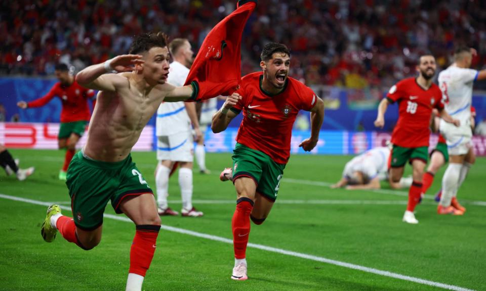 <span>Francisco Conceição whips off his shirt as he celebrates after scoring <a class="link " href="https://sports.yahoo.com/soccer/teams/portugal/" data-i13n="sec:content-canvas;subsec:anchor_text;elm:context_link" data-ylk="slk:Portugal;sec:content-canvas;subsec:anchor_text;elm:context_link;itc:0">Portugal</a>’s winner.</span><span>Photograph: Lisi Niesner/Reuters</span>