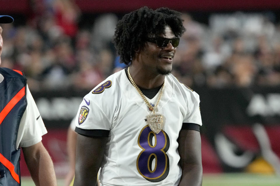 Baltimore Ravens quarterback Lamar Jackson watches during the first half of an NFL preseason football game against the Arizona Cardinals, Sunday, Aug. 21, 2022, in Glendale, Ariz. (AP Photo/Rick Scuteri)