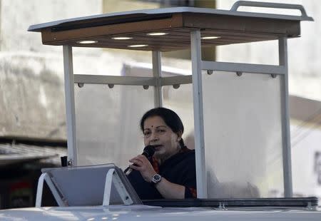 J. Jayalalithaa, chief minister of Tamil Nadu and chief of Anna Dravida Munetra Khazhgam (AIADMK), addresses her party supporters atop a vehicle during an election campaign rally in Chennai April 19, 2014. REUTERS/Babu/Files