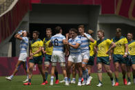 Argentina players, center, celebrate after defeating Australia in their men's rugby sevens match at the 2020 Summer Olympics, Monday, July 26, 2021 in Tokyo, Japan. (AP Photo/Shuji Kajiyama)