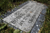 The blue pearl tombstone of Bobby Jean Knox, wife of Hosea Knox, marks her final resting place Wednesday, June 10, 2020, at the Mount Hope Cemetery on Chicago's Southside. Knox created her stone after losing her to cancer in 2012. (AP Photo/Charles Rex Arbogast)