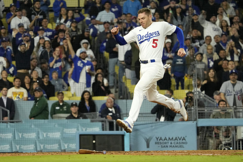 Los Angeles Dodgers' Freddie Freeman scores on a double by Max Muncy during the third inning of a baseball game against the St. Louis Cardinals Friday, April 28, 2023, in Los Angeles. (AP Photo/Mark J. Terrill)